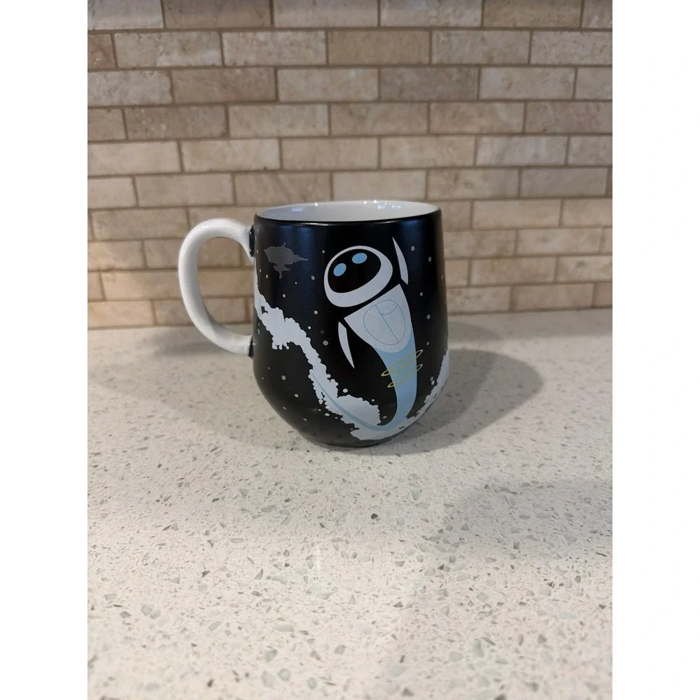 Disney Coffee Mug - WALL-E And E.V.E new - Picture 1 of 2